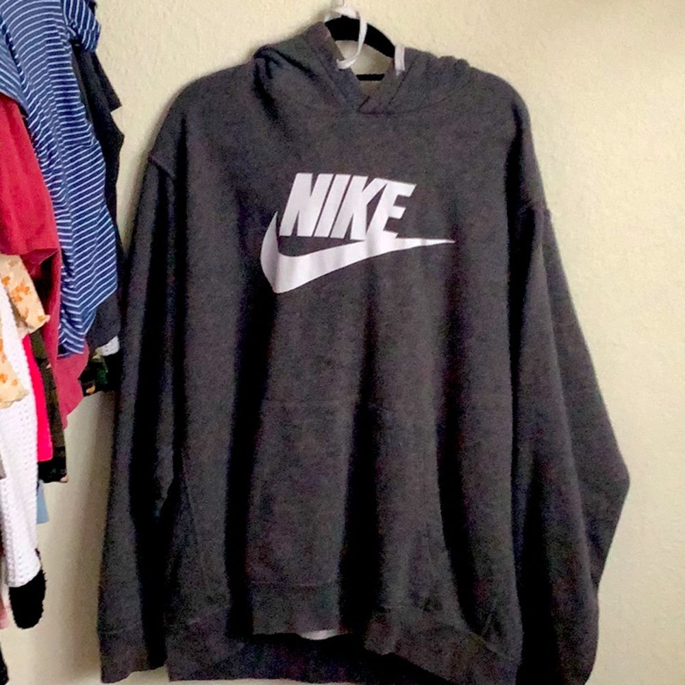 This is a mens Nike hoodie it is grey and you can wear it anytime
